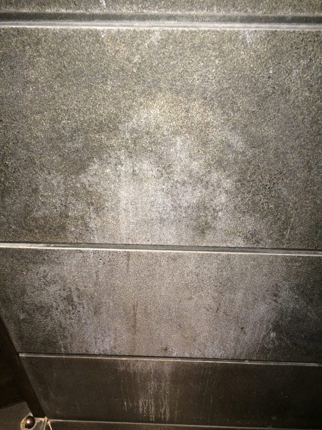 1 Textured black limestone BEFORE CLEANING
